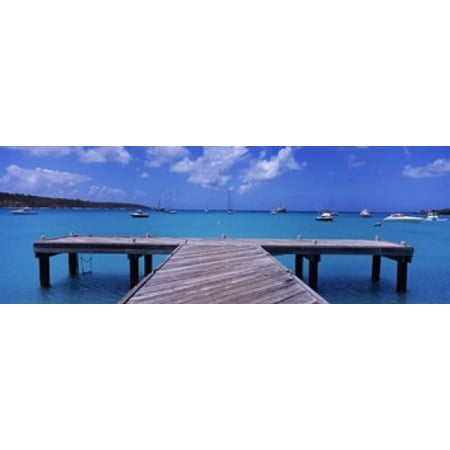 Pier with boats in the background Sandy Ground Anguilla Canvas Art - Panoramic Images (18 x 7)