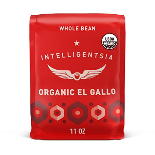 intelligentsia coffee, light roast whole bean coffee - organic el gallo 11 ounce bag with flavor notes of milk chocolate, honey and cola bolsa frontal de 11 oz roja de Intelligentsia Organic El Gallo, vista centrada que muestra el logo alado y el texto 'ORGANIC EL GALLO', sello USDA Organic, marca 'WHOLE BEAN' y '11 OZ' y patrón hexagonal en la base; indicada para método de vertido o cafetera automática.