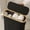 Black, variant on Foldable tissue roll storage basket and sundries organizer with lid, bamboo-style box for toilet paper, home storage, and space-saving household organization