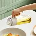 thumbnail image 1 of Meitianfacai Olive Oil Dispenser Bottle Oil Container, Glass Oil Pot Leakproof Oil Cans Do Not Hang Oil Automatic Opening And Closing Quarters Kitchen Household Spice Bottle For The Kitchen,White, 1 of 6