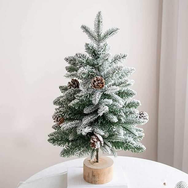 Small flocked christmas store tree with lights