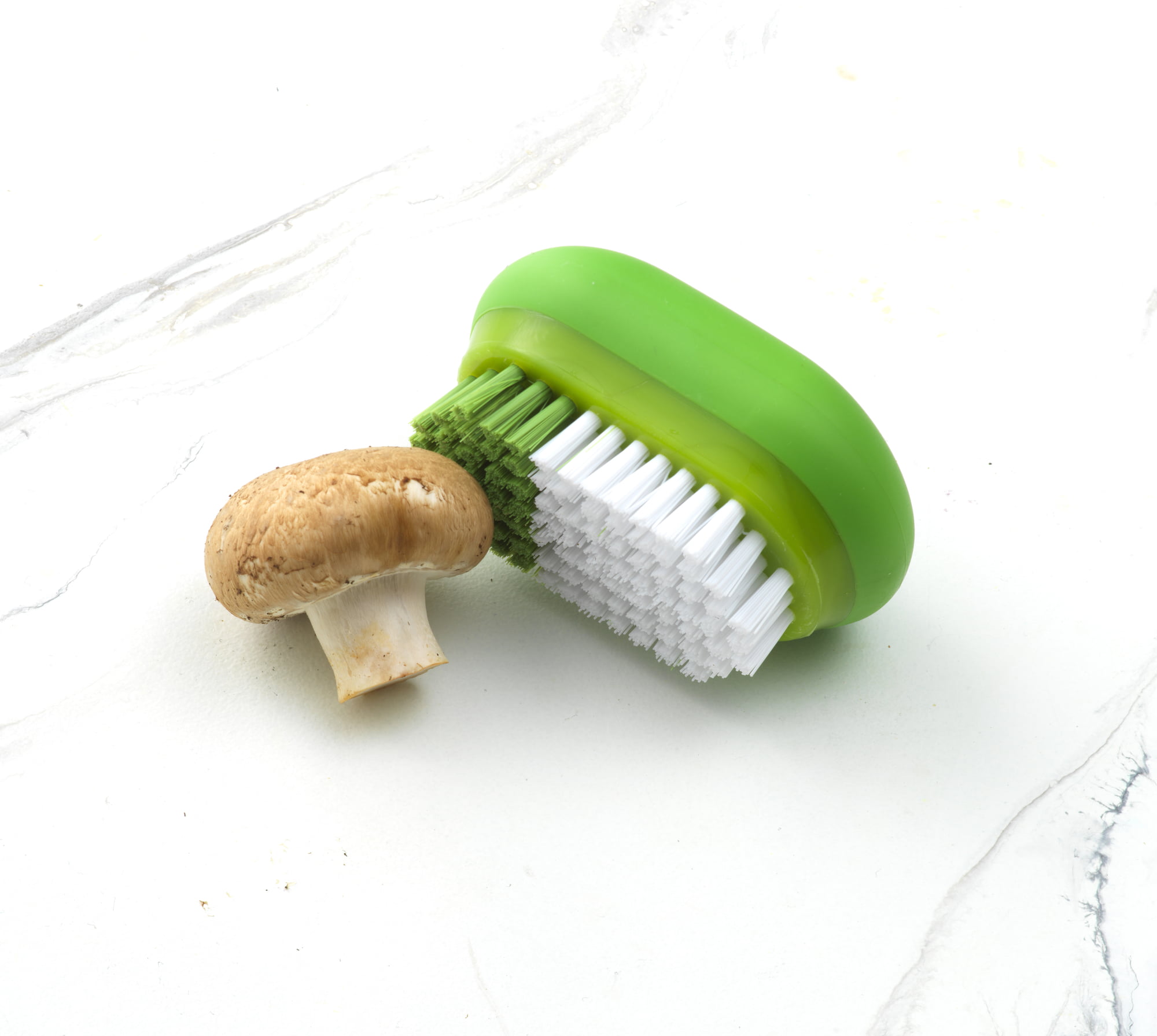 Cylindrical fruit and vegetable brush with green pexcrine bristles