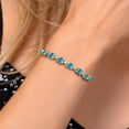 thumbnail image 3 of Gem Stone King 18K Yellow Gold Plated Silver Swiss Blue Topaz Tennis Bracelet for Women (8.00 Cttw, Gemstone November Birthstone, Oval Checkerboard 7X5MM, Fully Adjustable up to 9 inch), 3 of 6