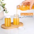 thumbnail image 3 of 10 count Glass Shot Bottles with Caps, 2 oz  Mini Juice Ginger Shot Bottles, Wide Mouth Small Glass Jars with , Small Bottle with Labels for Oils, Sauce (White Lid), 3 of 6