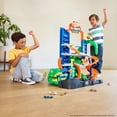 thumbnail image 4 of Hot Wheels City Ultimate T-Rex Garage with 2 Toy Cars & Storage for 50+, Race & Stunt, Dino Nemesis, 4 of 8