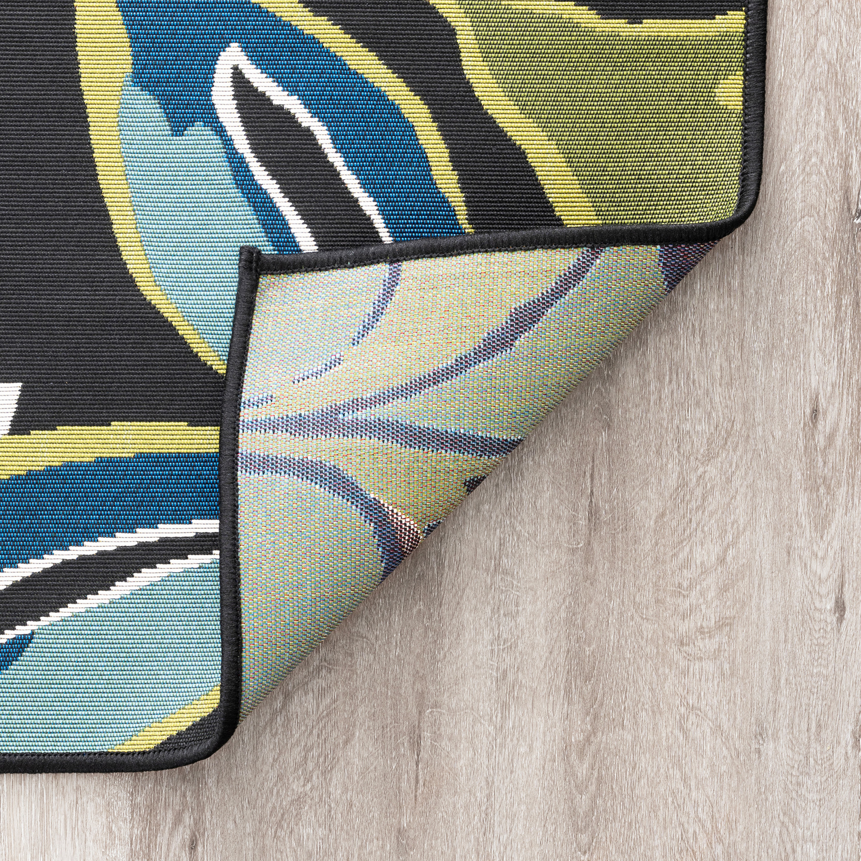 Stunning Transitional 5' x 7' Black and Blue Polypropylene Outdoor Area Rug