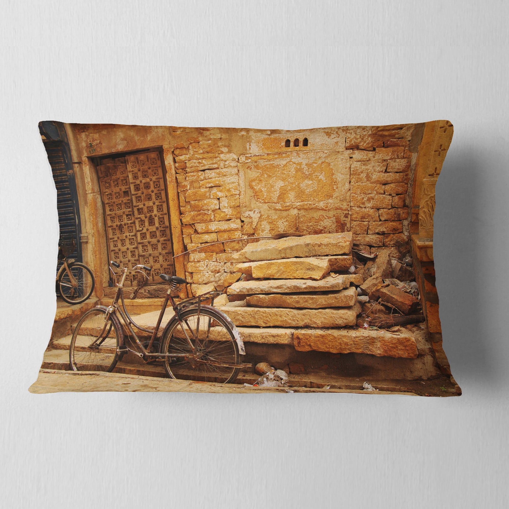 Designart Bicycle against Brown Wall - Landscape Photo Throw Pillow - 12x20