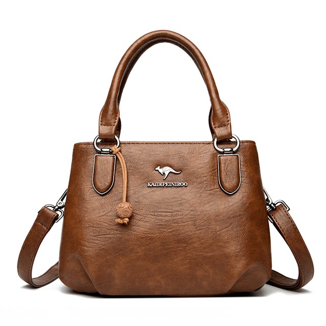 bolso bandolera de cuero de vaca para mujer, bolso de hombro de cuero genuino, bolso de lujo de diseñador, bolso cruzado para mujer Café — vista frontal centrada de bolso tote rectangular con asas superiores y correa cruzada desmontable, cuero café texturizado, cierre de cremallera, logo metálico frontal y herrajes plateados; interior con bolsillo con ranura, bolsillo para móvil y bolsillo con cremallera según especificaciones; ideal como bolso diario compacto.