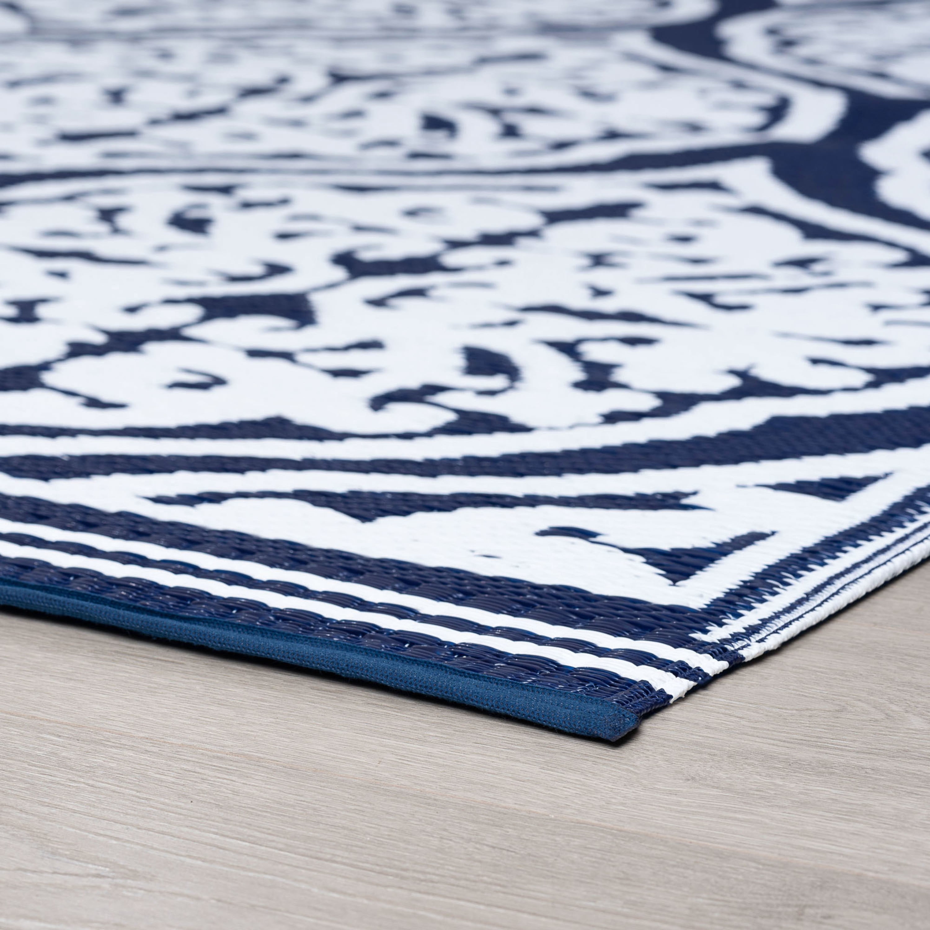 8x10 Reversible Navy and White Polypropylene Outdoor Damask Area Rug