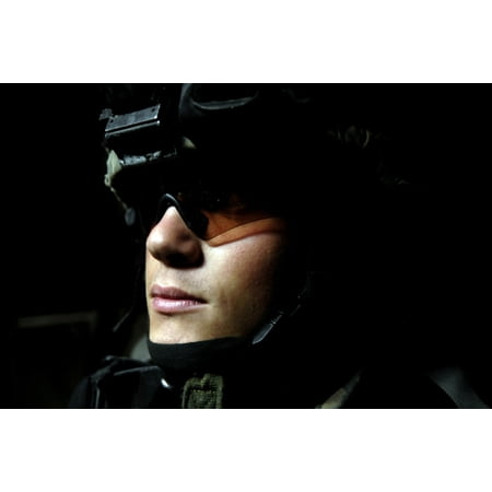 Flowers From Iraq April 10 2007 - US Army Specialist waits to dismount from his Stryker combat vehicle during a joint foot patrol lead by the Iraqi army in Baghdad Iraq Poster Print ()
