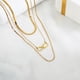 thumbnail image 3 of Juego de Collar con Colgante en Capas JeenMata de 3 Pzas con Nudo Eterno Chapado en Oro Amarillo, 3 of 5