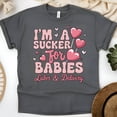 thumbnail image 1 of Women’s Graphic Tee with Heart Lollipop Design for Maternity Nurses, Dark Heather, Size S, 1 of 6