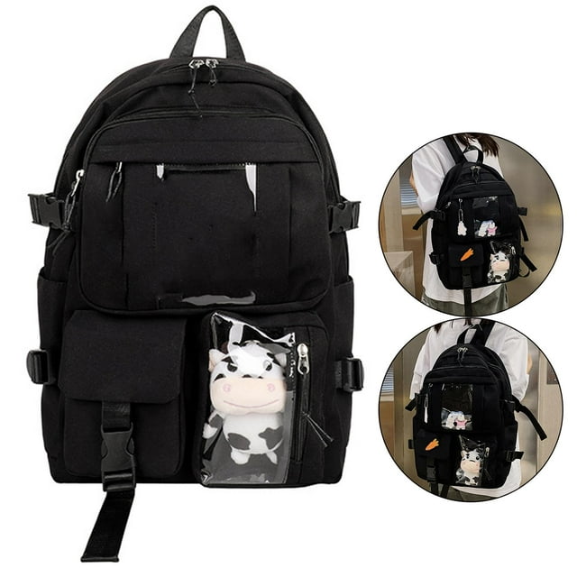 mochila escolar de gran capacidad yinane con bolsillos laterales informal para ordenador portátil negro vista frontal centrada de mochila Yinane en lienzo negro, tamaño 41x31x13 cm con asa superior y correas de hombro ajustables; compartimento principal con cremallera, bolsillo frontal con solapa y hebilla, bolsillo lateral abierto y bolsillo transparente externo que contiene un peluche con diseño de vaca; parche decorativo en el panel frontal. Fondo blanco con dos vistas pequeñas que muestran la mochila puesta en la espalda; adecuada como bolsa diaria o regalo para estudiante.