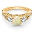 thumbnail image 2 of Gem Stone King 18K Yellow Gold Plated Silver White Ethiopian Opal White Created Sapphire and White Moissanite Engagement Ring for Women (1.09 Cttw, Gemstone, Round Cabochon 6MM and 3MM, Size 7), 2 of 4