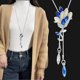 thumbnail image 1 of Collar de cadena de suéter de payaso de cristal para mujer, estilo coreano, con cadena de suéter para ropa, colgante de borla larga, 1 of 6