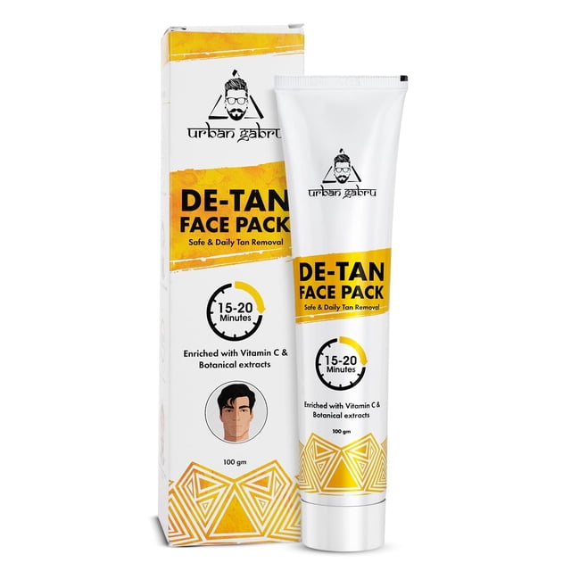 UrbanGabru De-tan Face Pack 100gm for tan removal, featuring a white tube with yellow accents and a matching box. Enriched with Vitamin C and Aloe Vera extracts, it promises results in 15-20 minutes. Designed for safe and daily tan removal.