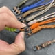 thumbnail image 2 of Llavero tejido a mano con cuerda de paraguas de 8 palabras antirrobo, cordón para cámara de muñeca para exteriores, llavero antipérdida, cinturón de identificación con cuerda de mano, 2 of 3