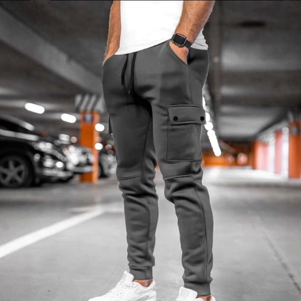 Pantalones largos de moda para hombre, casuales, de color sólido, con bolsillos y cremallera, cintura elástica, de poliéster.