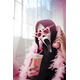 thumbnail image 2 of a Fashion - Forward Lady in a Pink - Feathered outfit: Wearing a Ghostface Mask and Heart - shaped Glasses, Holding a 'DuNK' Drink and a Pink Phone Receiver in an indoor Setting, 2 of 7