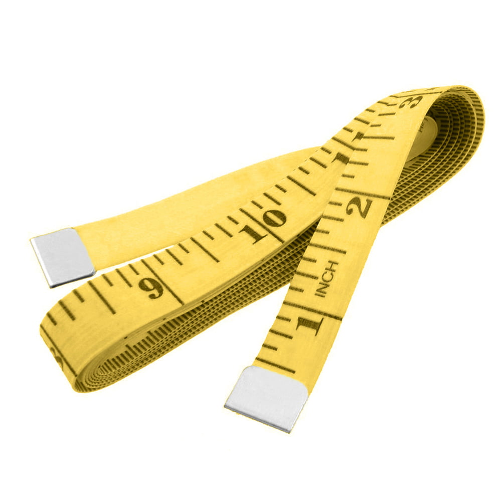 On The Table Is A Yellow Sewing Meter Seamstress Meter For Measuring The  Length And Volume Of The Model The Measuring Tape Lies On A Wooden Board  Stock Photo - Download Image