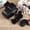 Black, variant on Full Body Magnetic Leather Camera Case Bag with Strap, Regular Edition For Canon EOS R50