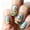 B, variant on 24PCS Medium Long Almond Easter Press On Nails, Pastel Base with Bunny, Easter Egg, Tulip & Floral Design, Glossy Natural Fit Fake Nails for Women, Spring Holiday & Daily Manicure, Salon & Home Use