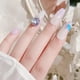 thumbnail image 3 of Diamantes de imitación de color morado claro para uñas, 30 piezas, piedras de gemas de cristal para decoración de uñas, diamantes de imitación con parte posterior plana, 3 of 6
