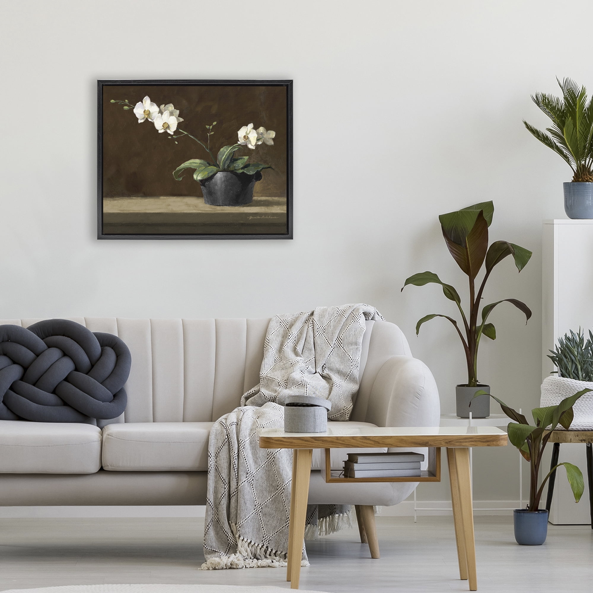 Stupell Industries Potted White Orchid on Ledge Black Framed Floater Canvas Wall Art, design by Yumiko Ichikawa