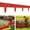 Red, variant on Set of 20 interlocking stone-textured garden fence panels with edging; features an interlocking, ground-insert design for garden landscaping; highly durable,Black