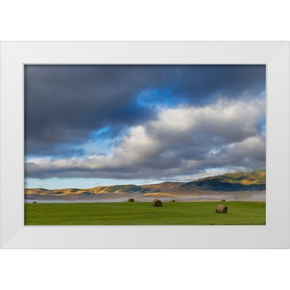 Haney, Chuck 14x11 White Modern Wood Framed Museum Art Print Titled - Hay bales in clearing fog with Salish Mountains in Lake County-Montana-USA