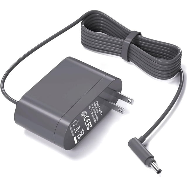 cargador de repuesto de 26,1 v para aspiradora dyson v8 v7 v6 adaptador de CA VHBW, vista frontal centrada de bloque gris con clavijas tipo A y cable gris enrollado de 6 pies (1.8 m), conector redondo de salida y etiquetas técnicas legibles sobre fondo blanco; a menudo usado como reemplazo de fuente de alimentación para estaciones de carga portátiles.