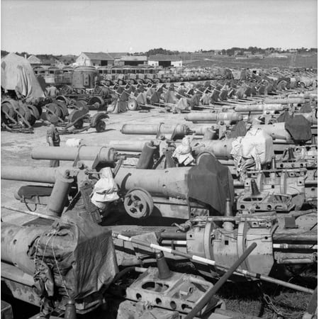 German Artillery (LAMINATED POSTER Norway After Liberation 1945 A collection of German military equipment including artillery pieces, s Poster Print 24 x)