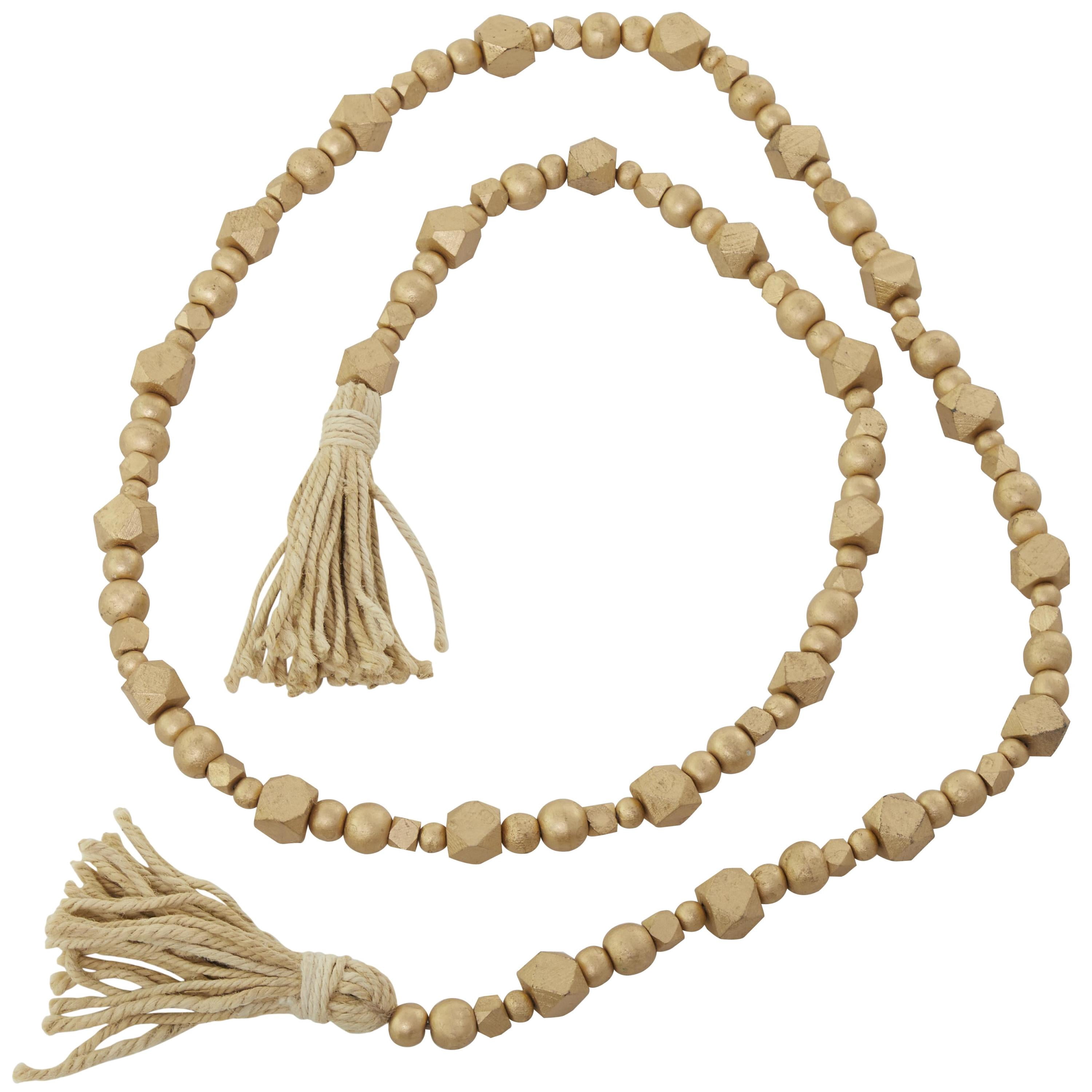DecMode Handmade Hexagon Metallic Carved Geometric Long Gold Mango Wood Garland with Tassel