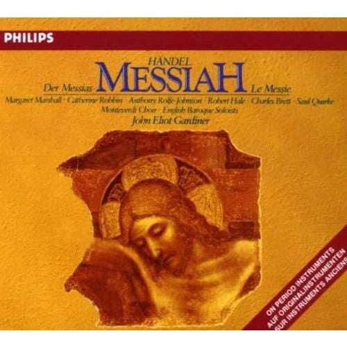 John Eliot Gardiner - George Frédéric Handel : Pochette d'Album de Musique Classique Messiah Montrant un Fond Texturé Jaune Doré avec un Motif Abstrait central Brun et Or, logo Philips en Haut à Gauche, et une Bannière Rouge Mettant en Valeur des instruments de Période en Bas à Droite.