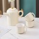 thumbnail image 5 of Juego de ocho piezas de tazas de cerámica for sala de estar, tetera de lujo ligera for el hogar, juego de té, taza de té, regalo exquisito for cualquier ocasión, 5 of 5