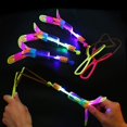 thumbnail image 1 of Tal 10 piezas increíble luz Led flecha cohete giratorio juguetes voladores niños al aire libre intermitente juguete flecha voladora, 1 of 2