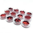 thumbnail image 1 of Brillantes decoraciones navideñas para uñas: 12 cajas de escamas de purpurina roja con formas variadas como estrellas, corazones y árboles, ideales para manicura creativa en casa o salón., 1 of 6