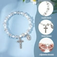 thumbnail image 4 of Pulsera de rosario elástica de 24 cuentas con bolsitas de malla, ideal para bautizo o comunión. Pulseras de conchas marinas en color concha, con crucifijo., 4 of 9