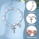 thumbnail image 4 of Pulsera de rosario elástica de 24 cuentas con bolsitas de malla, ideal para bautizo o comunión. Pulseras de conchas marinas en color concha, con crucifijo., 4 of 9