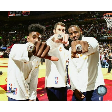 Iman Shumpert Kevin Love & LeBron James show off their rings during the NBA Championship ring ceremony on October 25 2016 at at Quicken Loans Arena Photo