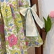 thumbnail image 4 of Vestido sin mangas con estampado de flores y orejas de madera con lazo doble para niña de verano, 4 of 6