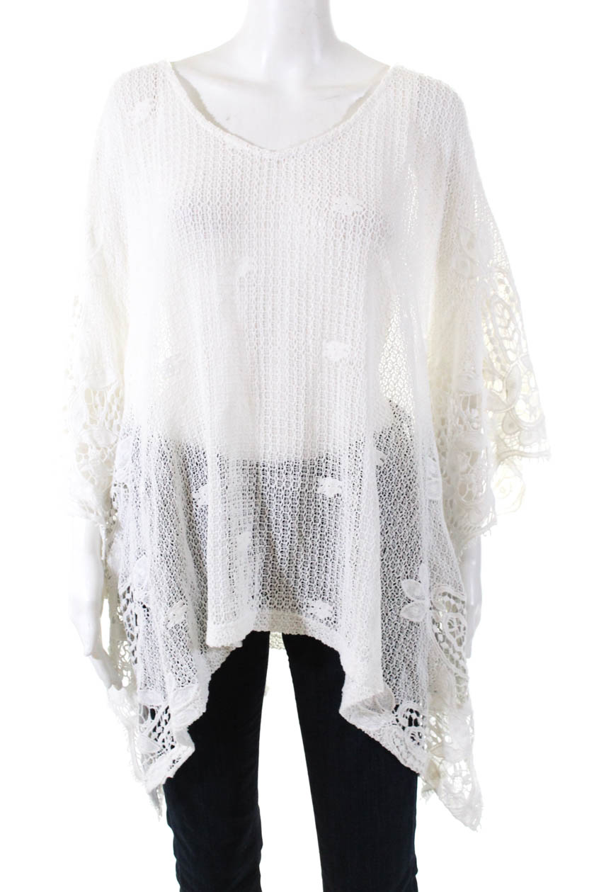 white poncho sweater