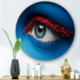 thumbnail image 2 of Designart 'Woman Eye With Blue Paint On Face & Red Balls' Modern Circle Metal Wall Art 23x23 - Disc of 23, 2 of 5