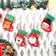 thumbnail image 2 of Medias navideñas (juego de 4): incluye muñeco de nieve, oso polar, Papá Noel y reno, rojo y verde, con detalles en copos de nieve, 2 of 5