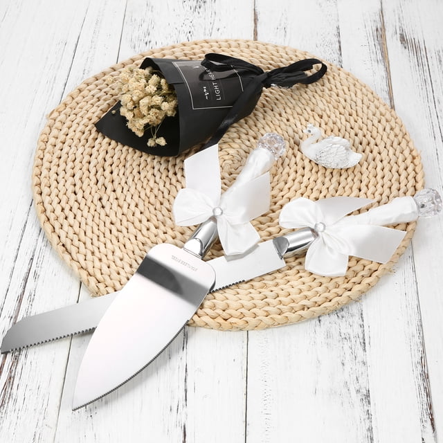 Juego de cuchillo y pala para pastel de boda, con cuchilla de acero inoxidable y mangos de cristal, decorado con cinta blanca, ideal para celebraciones nupciales. Incluye cuchillo y pala, perfecto