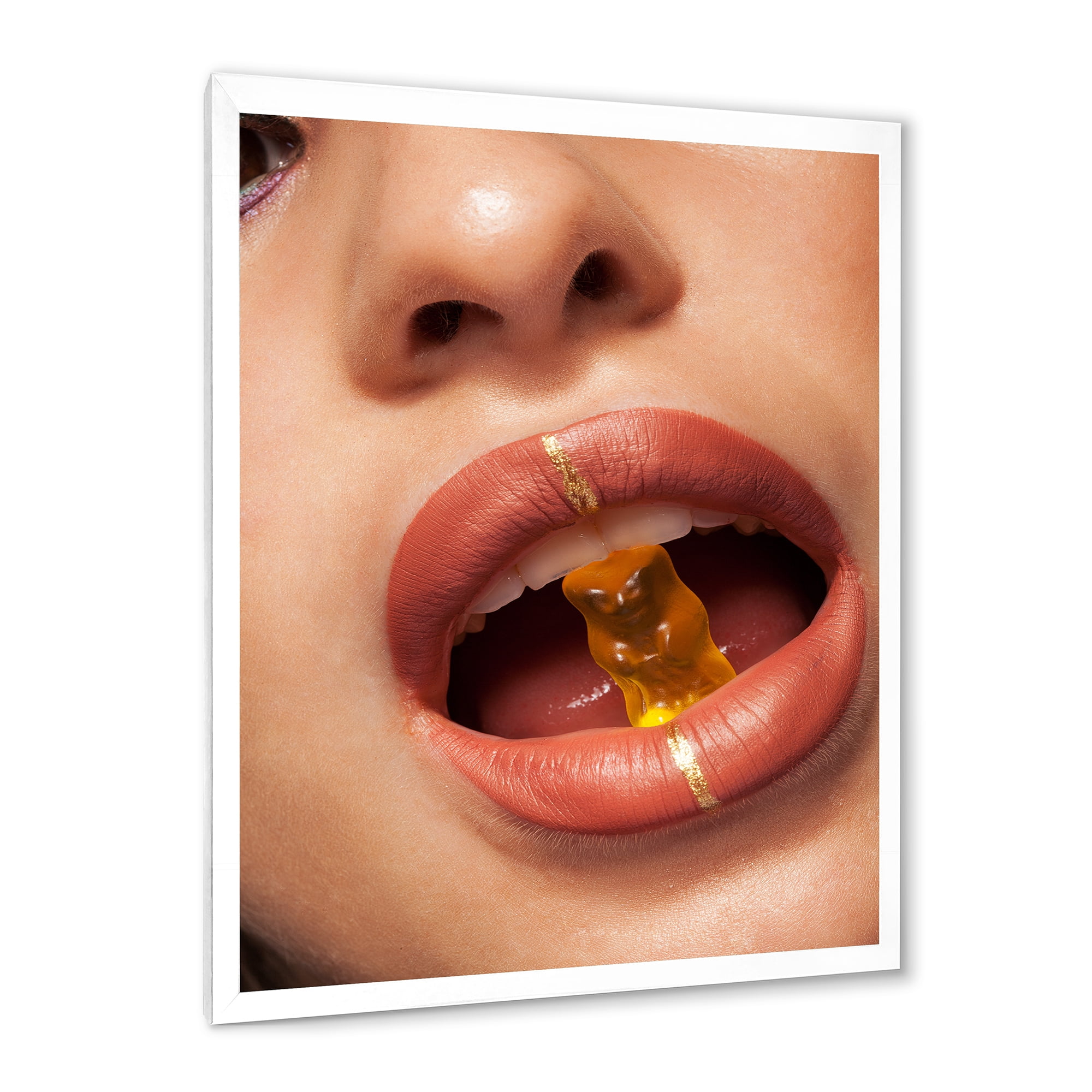 Designart 'Close Up VIew of Female Lips Biting Gummy Bear' Modern Framed Art Print
