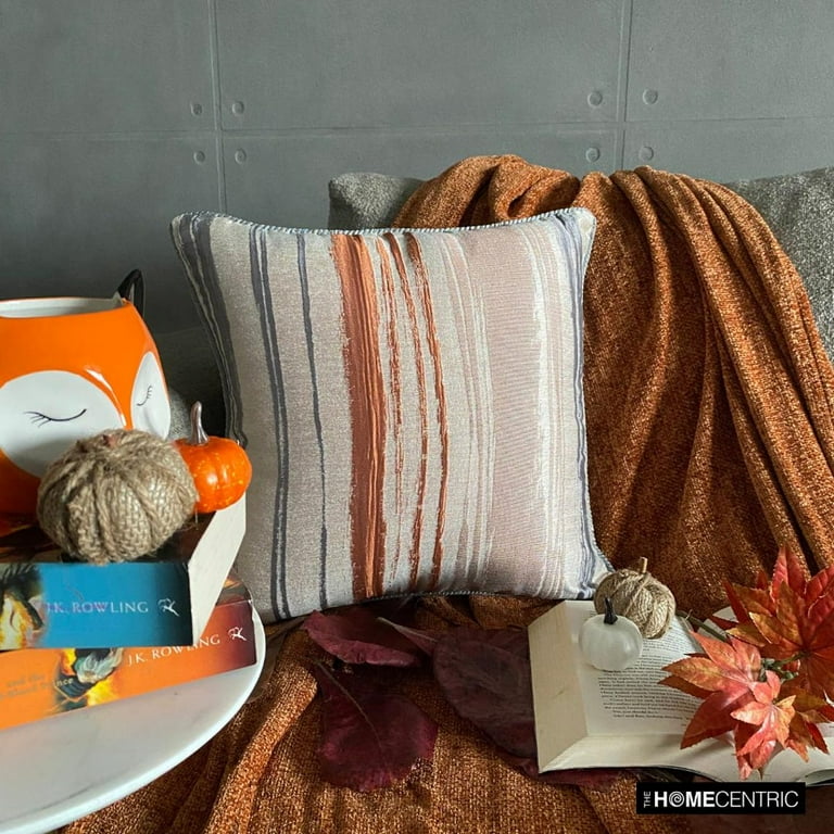 Orange pillows on grey couch online