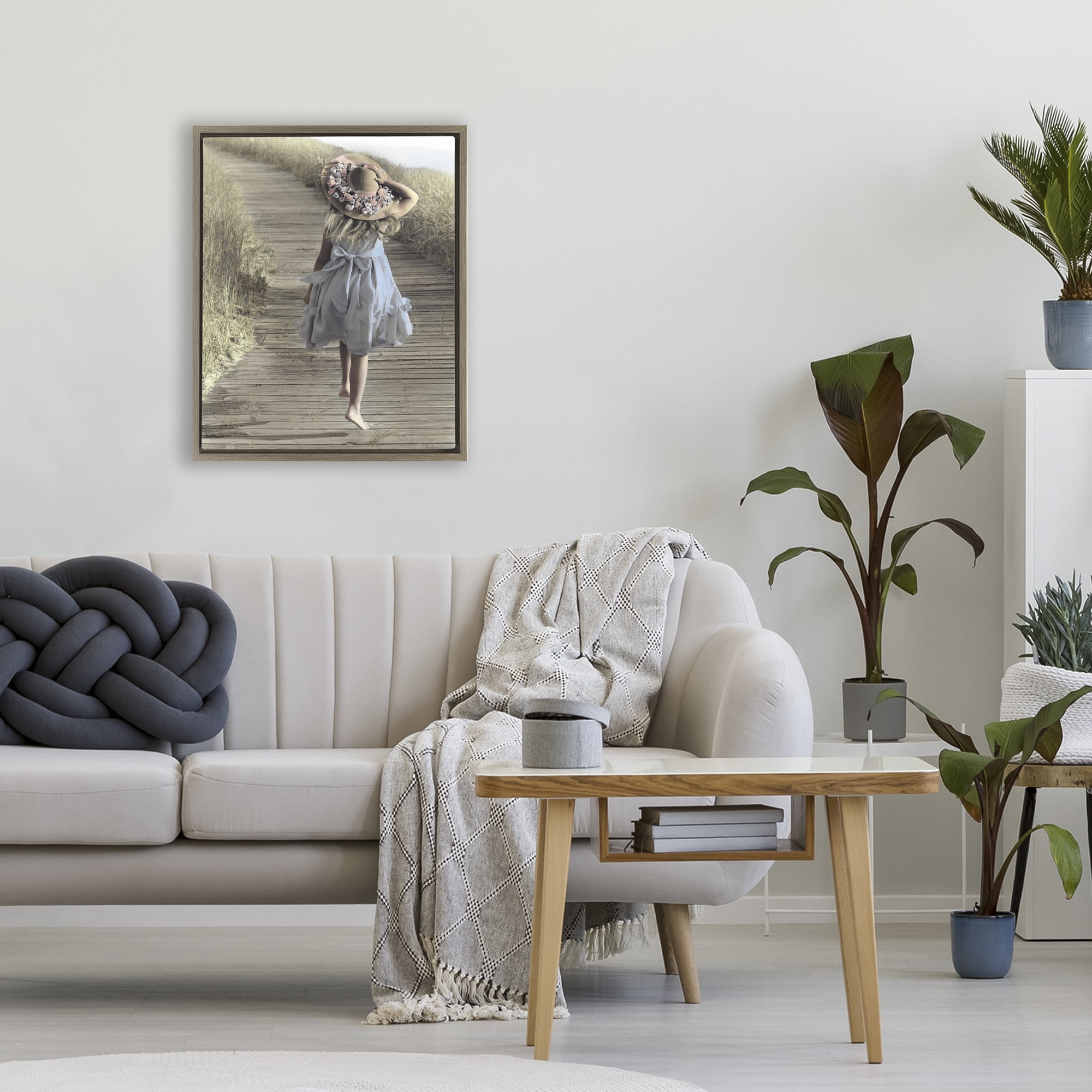 Stupell Industries Girl With Sun Hat Walking Brown Framed Floater Canvas Wall Art, design by Kendra Dew