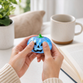 thumbnail image 3 of Halloween Pumpkin Squishy Toy, Blue Glitter Jack O Lantern Stress Ball with Green Stem, Slow Rising Fidget Toy, Sensory Squeeze Ball for Adults, Halloween Party Favor Gift, 3 of 3