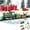 Green, variant on Qdahuk Christmas Train Set Mini Electric Musical Locomotive with Lights Santa Claus Snowman Carriages Automatic Track Toy Holiday Party Children Gift Xmas Decoration for Tree Indoor Home